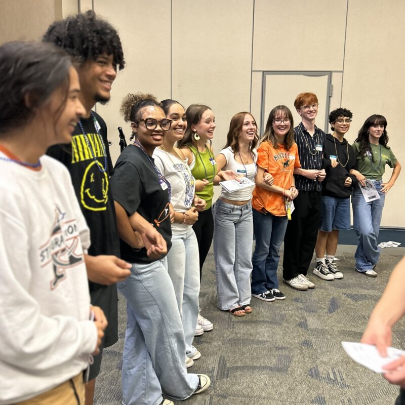 Executive student mentors practice facilitation during a breakout training session.